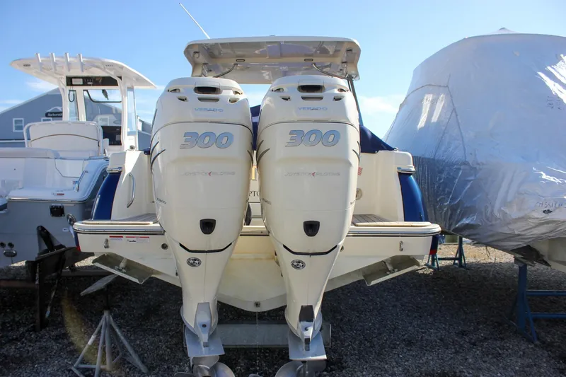 Slide: The Image of 2018 Chris-Craft Calypso 30 boat interior with luxurious seating and sleek design. - 1