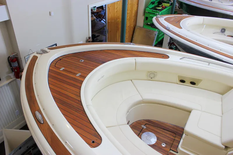 Slide: The Image of 2018 Chris-Craft Calypso 30 boat interior with sink and storage on teak deck. - 19