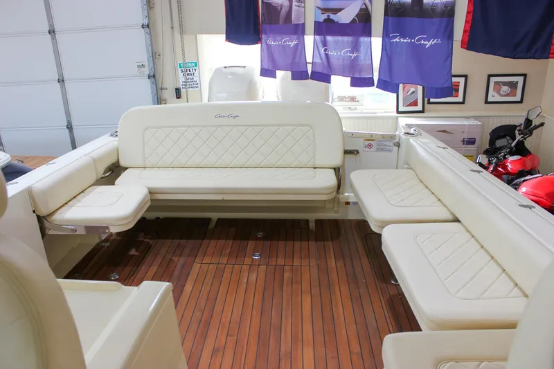 Slide: The Image of 2018 Chris-Craft Calypso 30 interior with elegant seating and wooden flooring. - 27