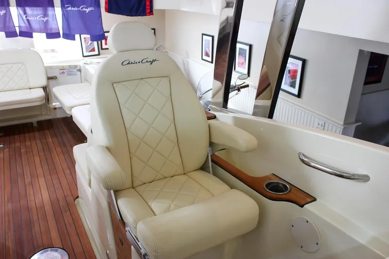Slide: The Image of Luxurious interior of 2018 Chris-Craft Calypso 30 boat with plush seating and wood accents. - 33