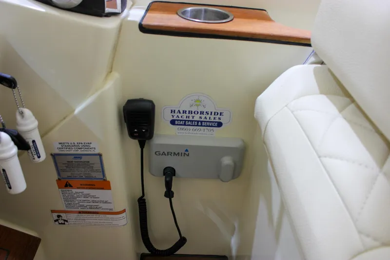Slide: The Image of 2018 Chris-Craft Calypso 30 interior with Garmin device and Harborside Yacht Sales sticker. - 40