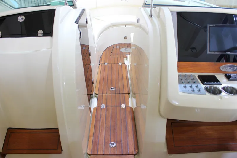Slide: The Image of 2018 Chris-Craft Calypso 30 interior with wooden flooring and modern control panel. - 45