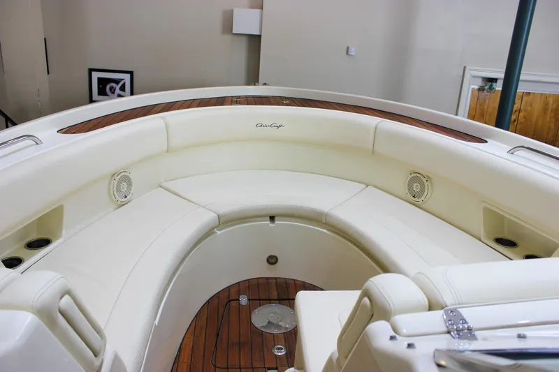 Slide: The Image of 2018 Chris-Craft Calypso 30 boat interior with elegant seating and wood accents. - 54