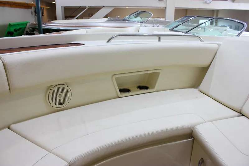Slide: The Image of Luxurious seating area on a 2018 Chris-Craft Calypso 30 boat with built-in speaker. - 61