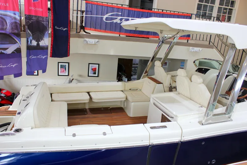 Slide: The Image of 2018 Chris-Craft Calypso 30 boat interior with luxurious seating and elegant design. - 68