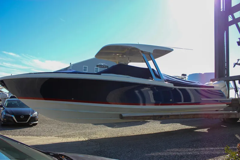 Slide: The Image of 2018 Chris-Craft Calypso 30 boat on display under bright sunlight. - 72