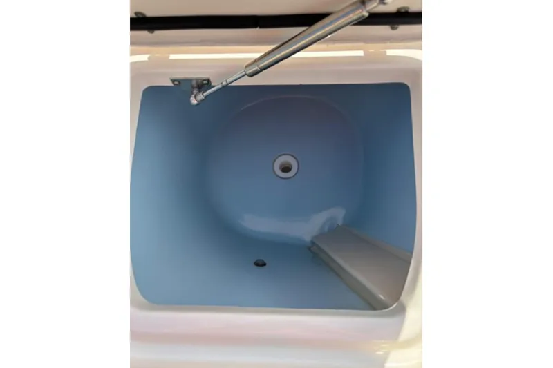 Slide: The Image of 2022 Grady-White Fisherman 257 boat with rod holders, against a clear blue sky. - 16