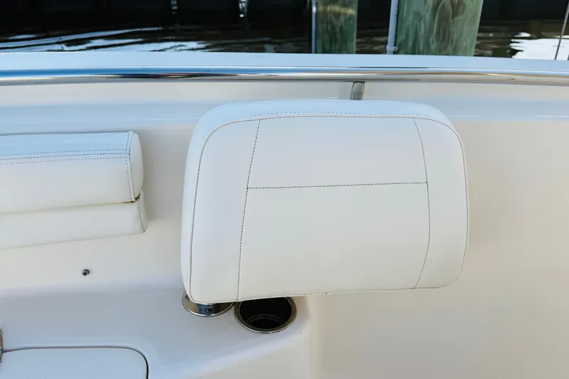 Slide: The Image of 2022 Grady-White Fisherman 257 boat seat with white upholstery and stainless steel accents. - 30
