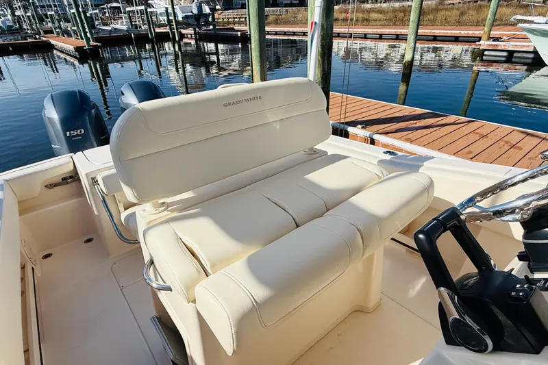 Slide: The Image of 2022 Grady-White Fisherman 257 boat interior with dual engines at dock. - 32