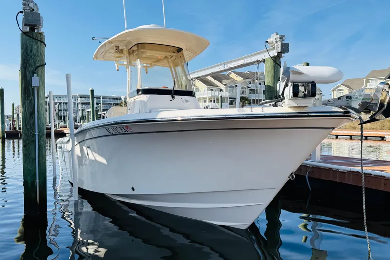 Slide: The Image of 2022 Grady-White Fisherman 257 boat docked at marina, clear blue sky background. - 37