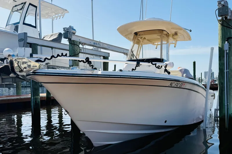 Slide: The Image of 2022 Grady-White Fisherman 257 boat docked at marina, clear sky background. - 38