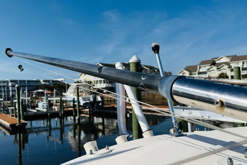 Slide: The Image of 2022 Grady-White Fisherman 257 boat docked at marina, clear blue sky background. - 40