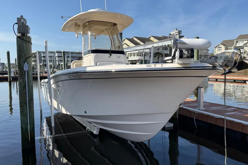 Slide: The Image of 2022 Grady-White Fisherman 257 boat docked in marina, clear sky background. - 42