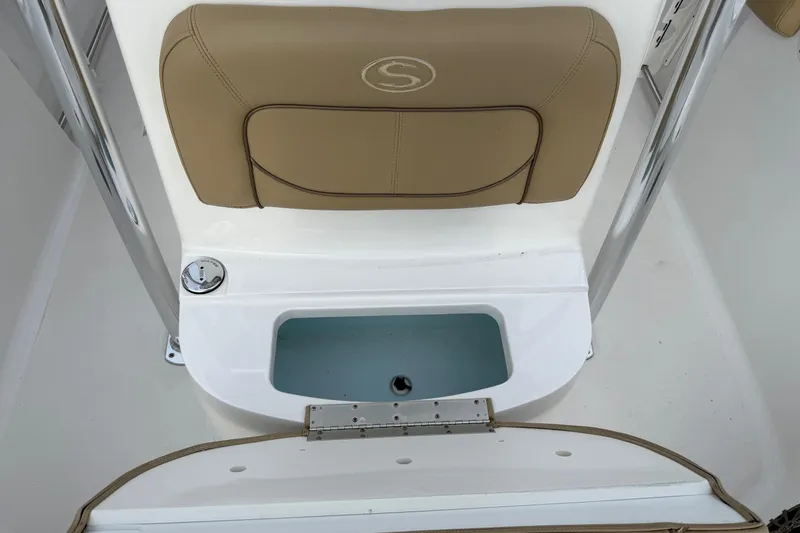 Slide: The Image of 2017 Sportsman Open 232 Center Console boat seat and storage compartment. - 11