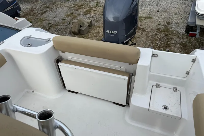 Slide: The Image of 2017 Sportsman Open 232 Center Console boat interior with seating and Yamaha 200 engine. - 6