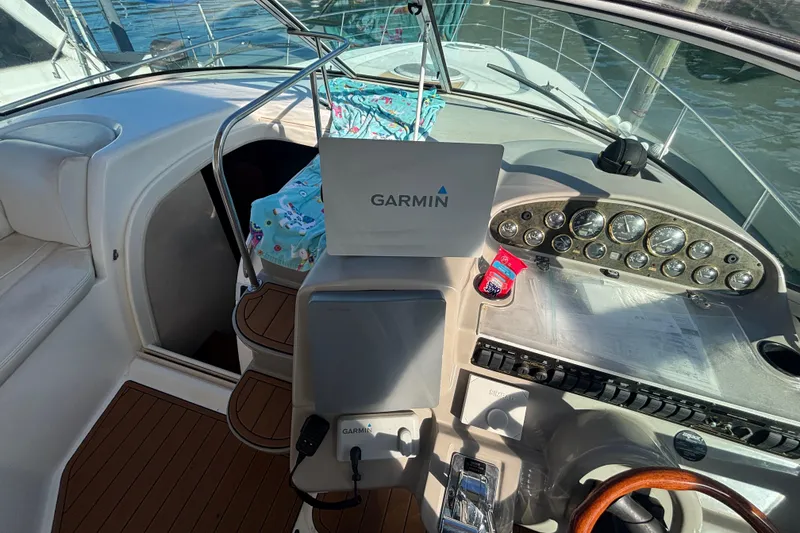 Slide: The Image of 2002 Cruisers Yachts helm with Garmin navigation system and control panel. - 9