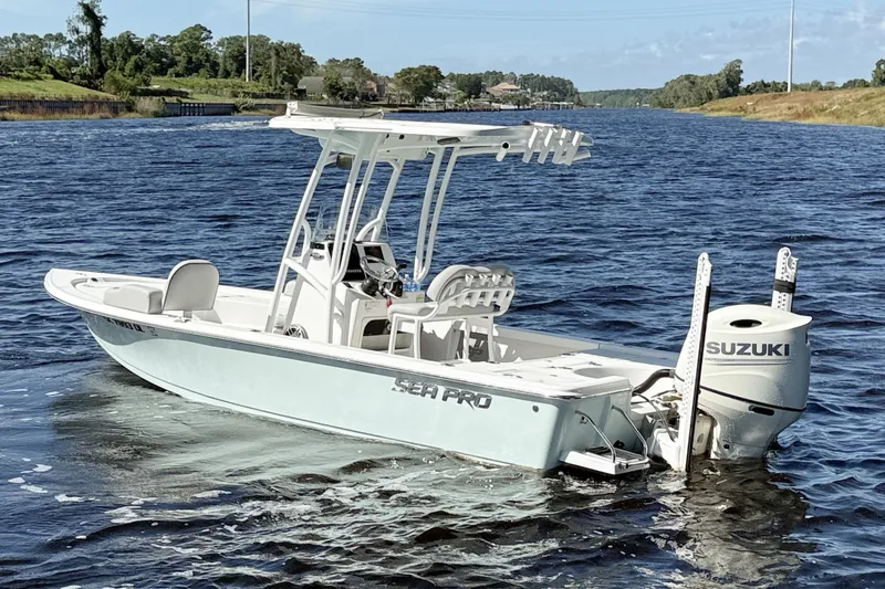 Slide: The Image of 2020 Sea Pro 228 Center Console boat on a calm river with Suzuki engine. - 0