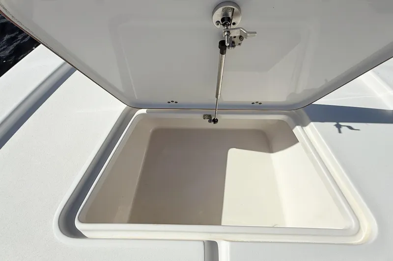 Slide: The Image of Open storage compartment on 2020 Sea Pro 228 Center Console boat. - 11