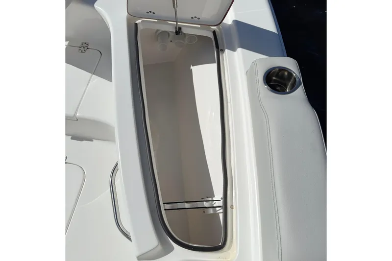 Slide: The Image of Open storage compartment on 2020 Sea Pro 228 Center Console boat. - 24