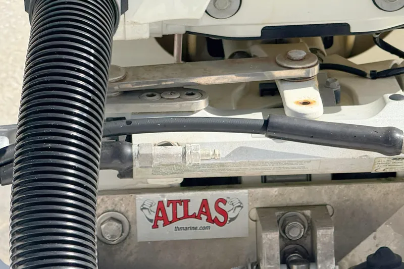 Slide: The Image of Close-up of 2020 Sea Pro 228 Center Console boat engine components with Atlas branding. - 25