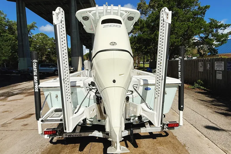 Slide: The Image of 2020 Sea Pro 228 Center Console boat on trailer, rear view, under bridge. - 7