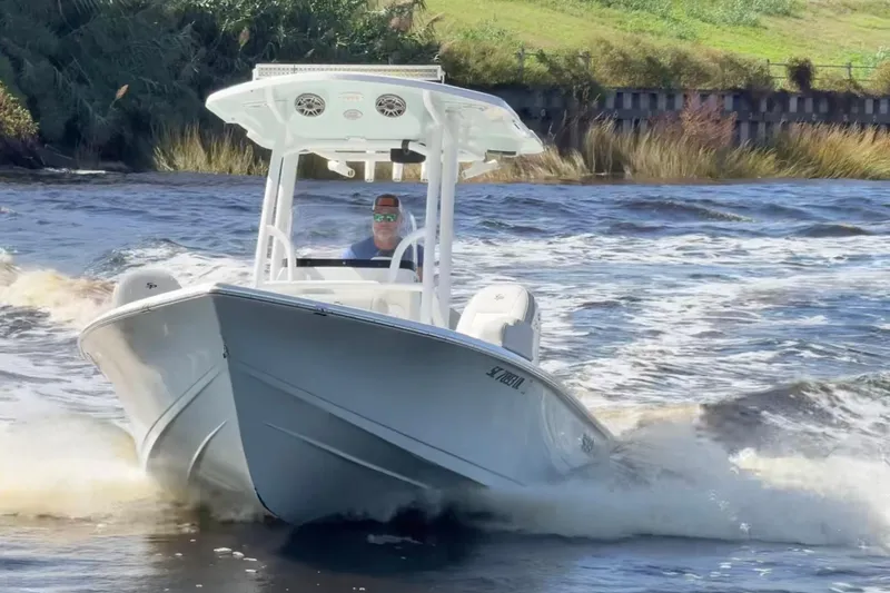 Slide: The Image of 2020 Sea Pro 228 Center Console boat navigating through choppy waters. - 8