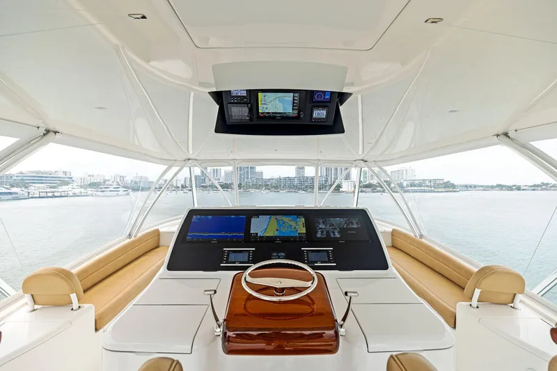 Slide: The Image of Luxurious helm of 2018 Viking 80 Convertible yacht with advanced navigation systems. - 12