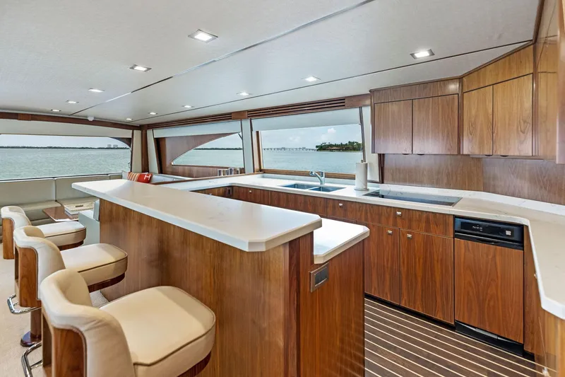 Slide: The Image of Luxurious interior of 2018 Viking 80 Convertible yacht with modern kitchen and ocean view. - 17