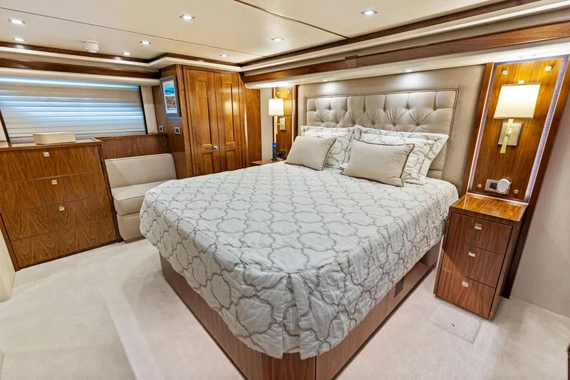 Slide: The Image of Luxurious bedroom interior of 2018 Viking 80 Convertible yacht with elegant wood finishes. - 21