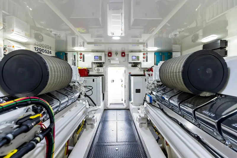 Slide: The Image of Engine room of 2018 Viking 80 Convertible yacht, showcasing advanced machinery and equipment. - 23