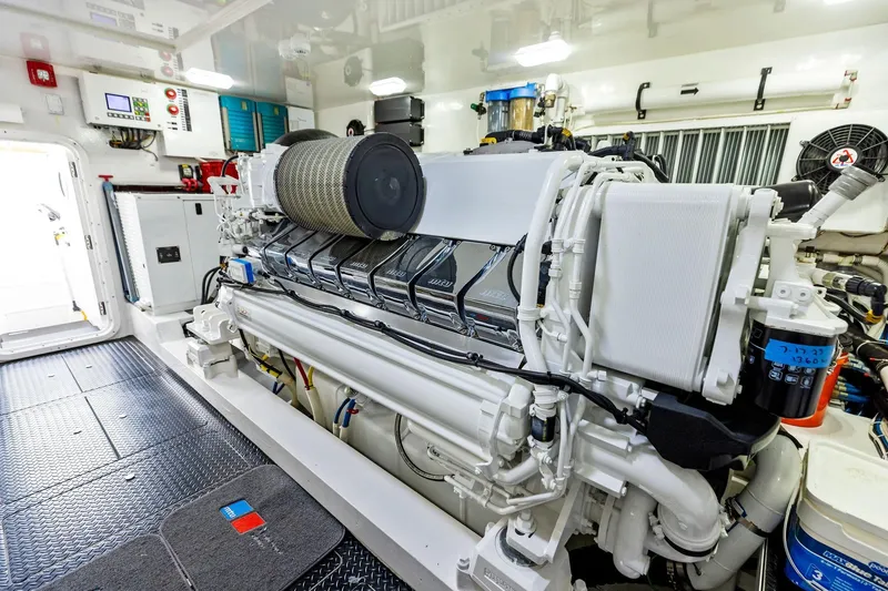 Slide: The Image of Engine room of 2018 Viking 80 Convertible yacht, featuring advanced machinery and equipment. - 24