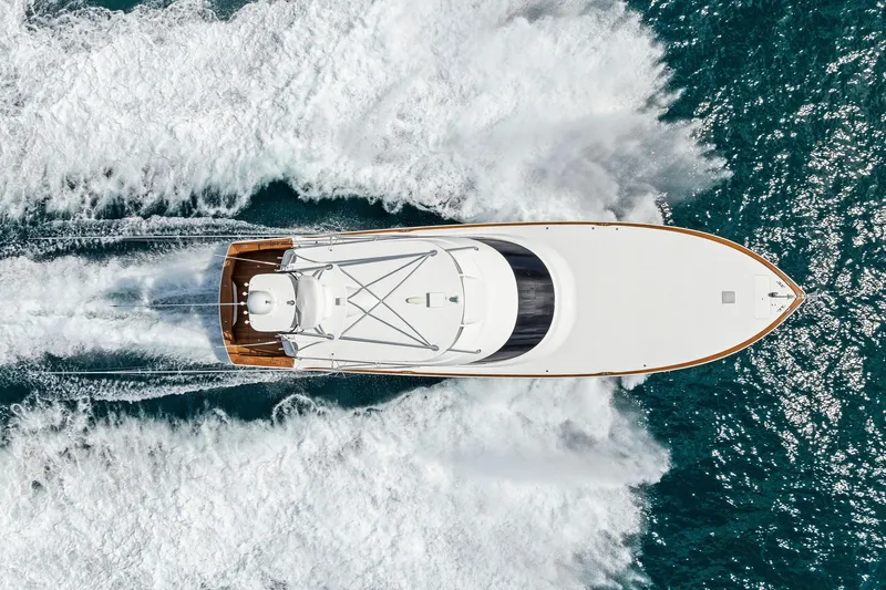 Slide: The Image of Overhead view of 2018 Viking 80 Convertible yacht cruising through ocean waves. - 3