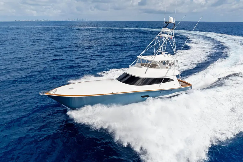 Slide: The Image of 2018 Viking 80 Convertible yacht cruising on open ocean waters. - 5