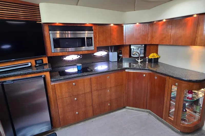 Slide: The Image of 2005 Cruisers Yachts 500 Express cabin entrance with stairs and sleek design. - 26