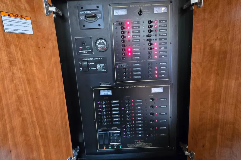 Slide: The Image of Luxurious interior of 2005 Cruisers Yachts 500 Express with elegant wood finish and plush seating. - 27