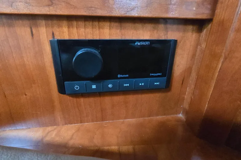 Slide: The Image of Luxurious cabin interior of 2005 Cruisers Yachts 500 Express with cozy bedding. - 28