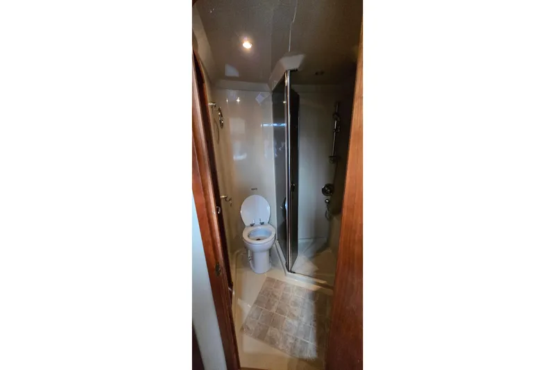 Slide: The Image of 2005 Cruisers Yachts 500 Express interior with built-in TV and DVD player. - 33