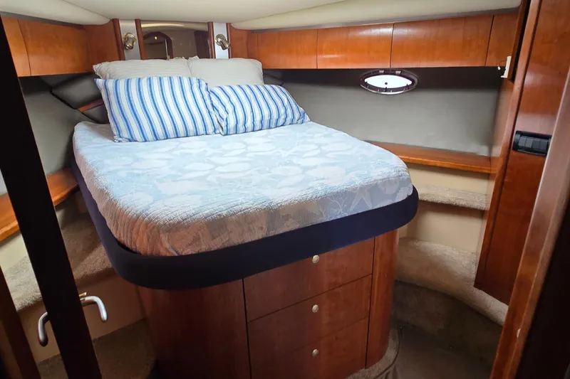 Slide: The Image of 2005 Cruisers Yachts 500 Express bathroom with wooden cabinetry and modern fixtures. - 36