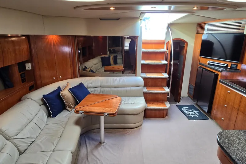 Slide: The Image of Luxurious bathroom in 2005 Cruisers Yachts 500 Express with wood cabinetry and modern fixtures. - 37