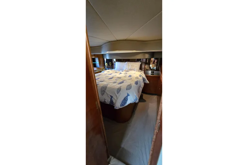 Slide: The Image of Luxurious interior of 2005 Cruisers Yachts 500 Express with leather seating and wood accents. - 38