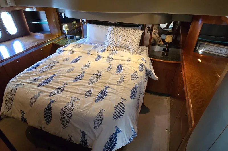 Slide: The Image of Luxurious 2005 Cruisers Yachts 500 Express interior with modern kitchen and elegant wood finishes. - 39