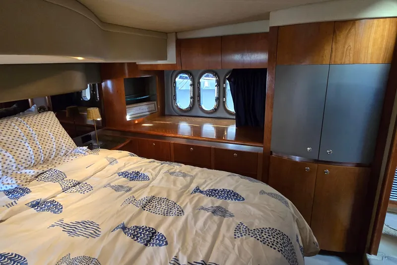 Slide: The Image of Luxurious interior of 2005 Cruisers Yachts 500 Express with modern kitchen and seating area. - 40