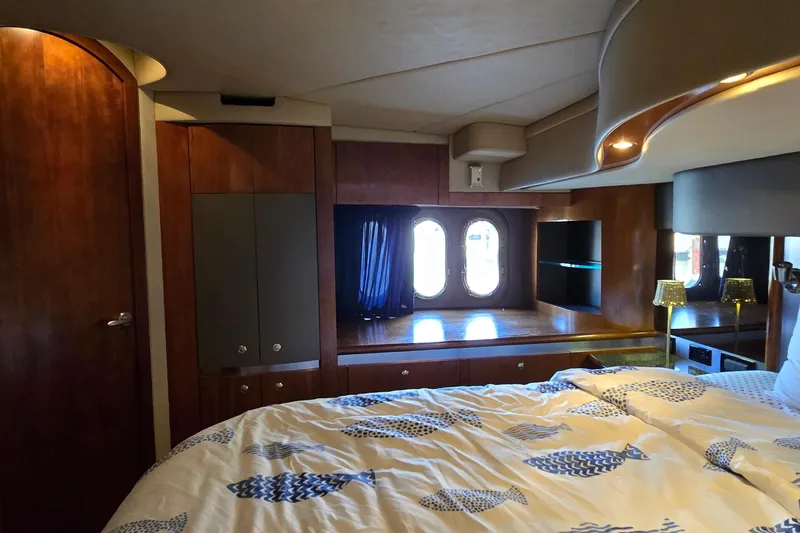 Slide: The Image of Luxurious 2005 Cruisers Yachts 500 Express interior with leather seating and wooden table. - 41