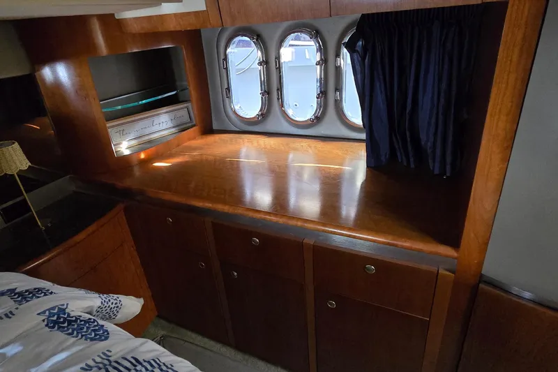 Slide: The Image of Luxurious bedroom interior of 2005 Cruisers Yachts 500 Express with modern amenities. - 47