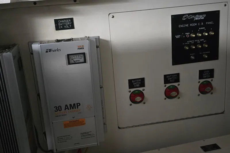 Slide: The Image of Engine room of 2005 Cruisers Yachts 500 Express with Onan marine generator and control panels. - 58