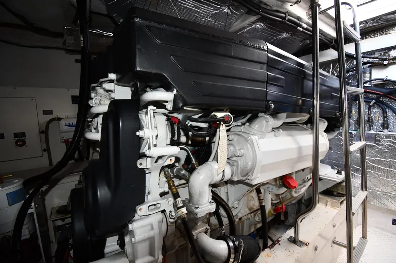 Slide: The Image of Engine room of 2005 Cruisers Yachts 500 Express, showcasing detailed machinery and components. - 60