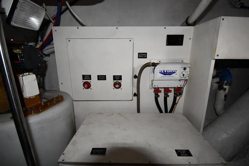 Slide: The Image of Engine room of 2005 Cruisers Yachts 500 Express with control panel and Reverso oil change system. - 64