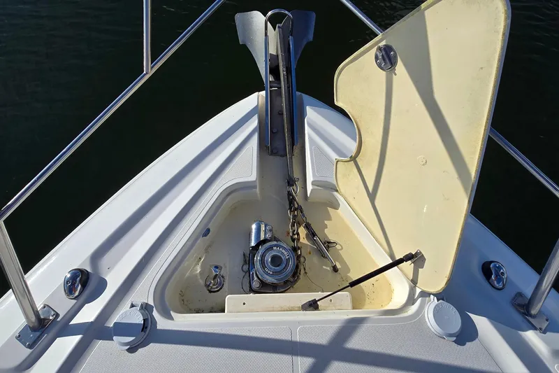 Slide: The Image of 2005 Cruisers Yachts 500 Express docked under a clear blue sky. - 7