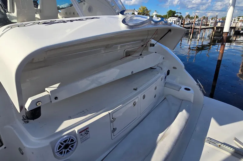 Slide: The Image of 2005 Cruisers Yachts 500 Express helm with modern controls and panoramic marina view. - 10