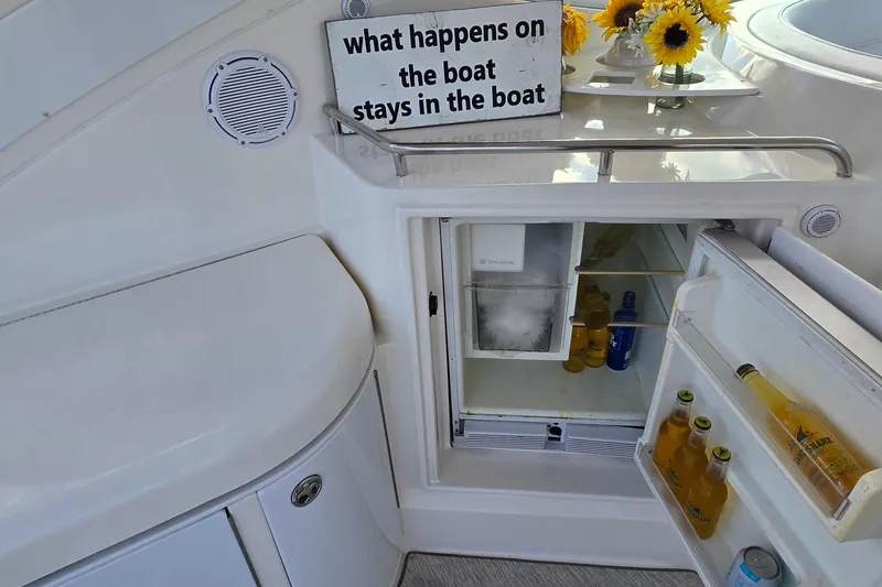 Slide: The Image of Control panel of a 2005 Cruisers Yachts 500 Express, featuring switches and communication equipment. - 14